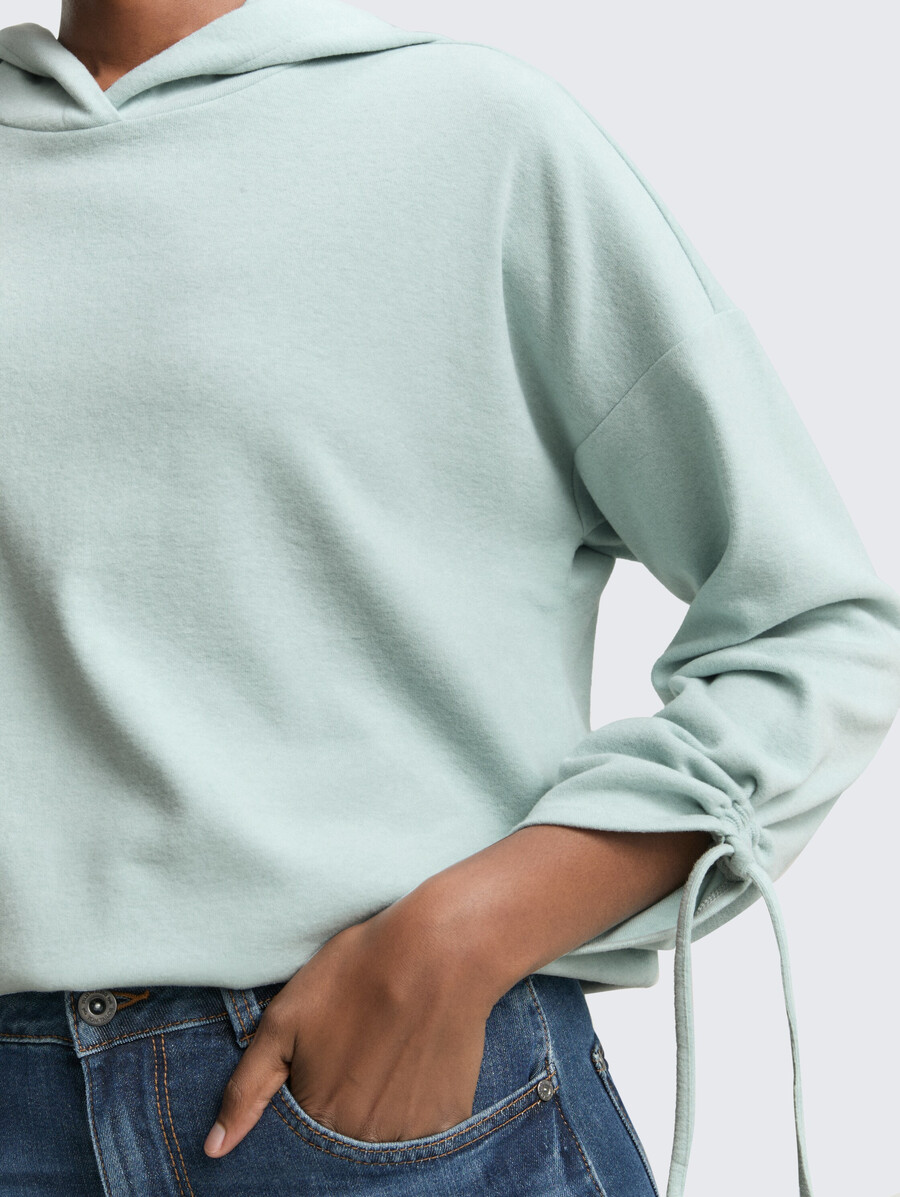 locker geschnittenes langarmshirt mit kapuze