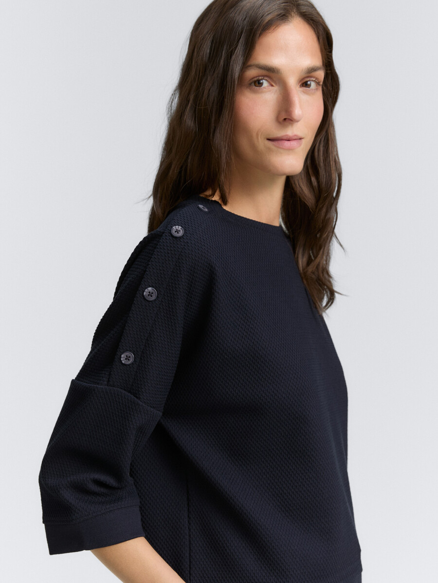 sweatshirt mit knopfdetails