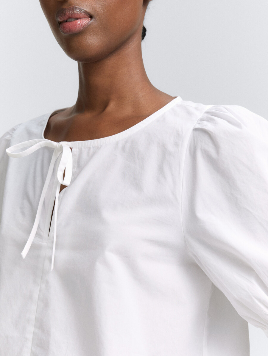 popelinebluse mit schleifendetail