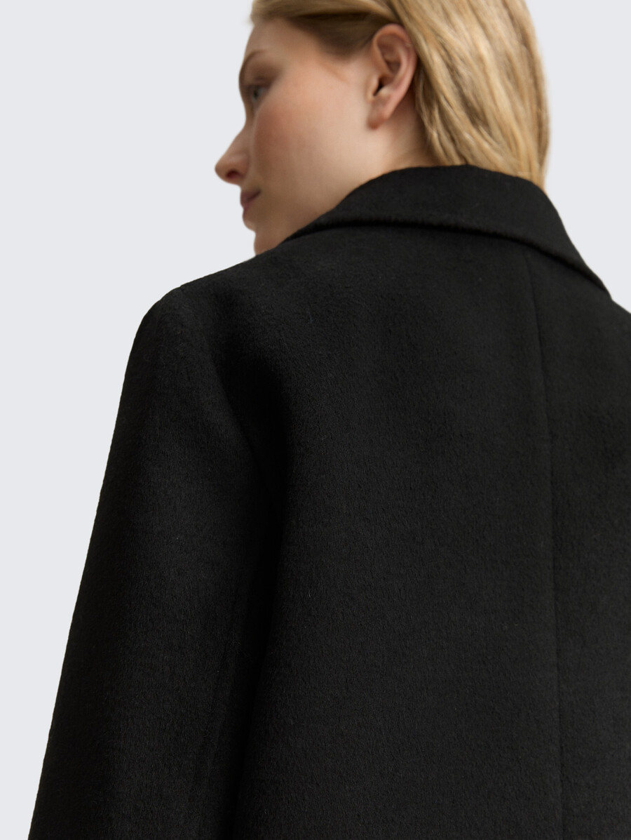 wollmantel mit eingrifftaschen